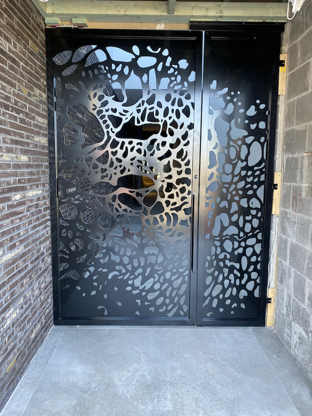 Custom laser cut steel gate with intricate decorative pattern for Eastern Suburbs Bondi Sydney property - precision manufacturing by A&E Metal Craft